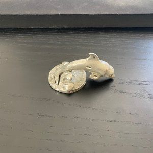 Silver dolphin figurine